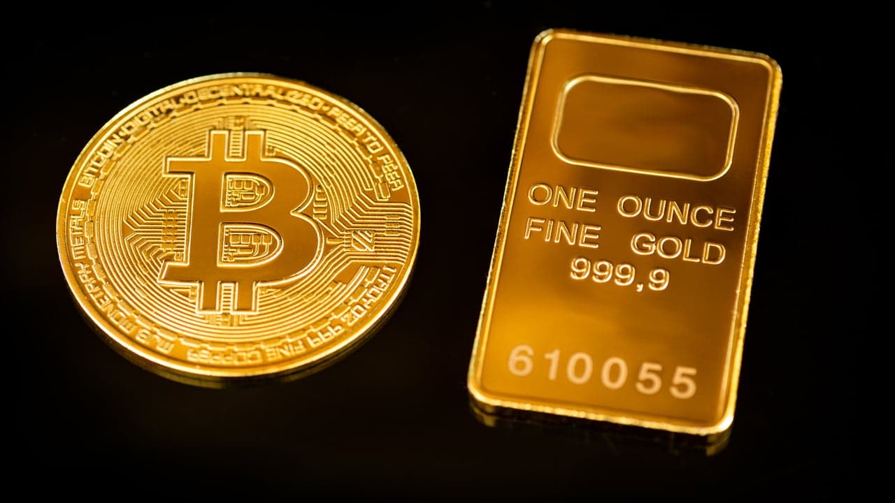Gold Hits Nine-Month Low as Bitcoin Climbs Amid Hawkish Fed Stance
