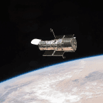 A Figure-Eight in Deep Space: Hubble Image Shows Gravity Warping Distant Galaxies